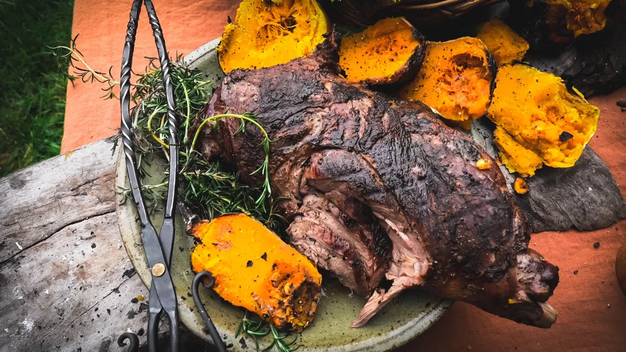 Fire roasted leg of lamb over open coals